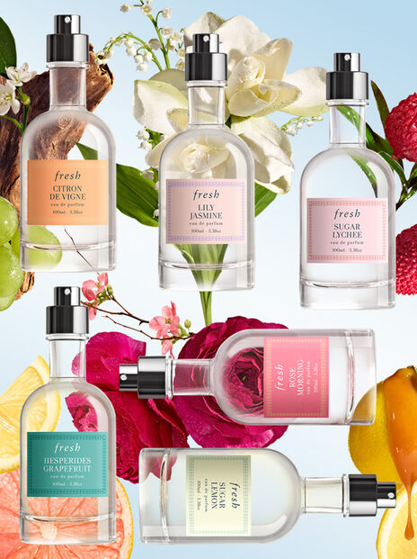 Six Fresh perfume bottles floating against a floral background
