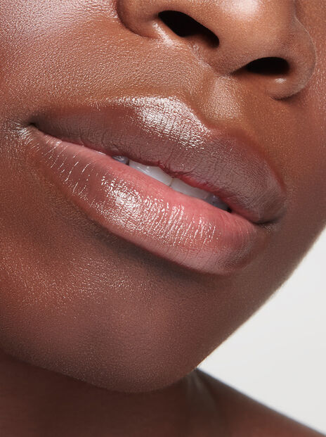 Close-up of woman's slightly parted moisturized lips