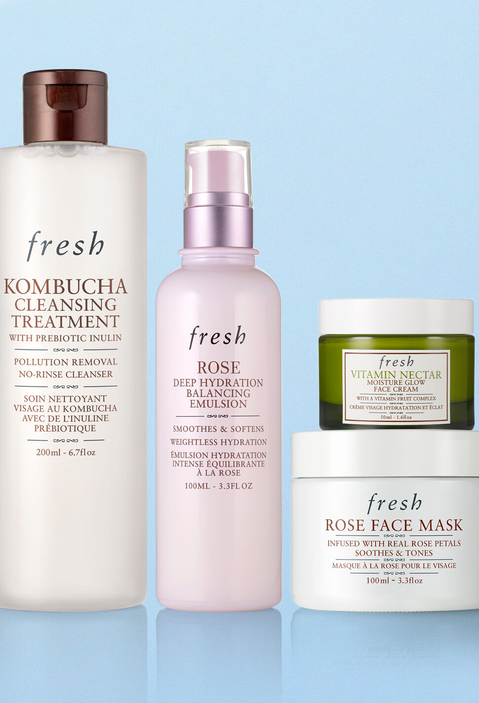 Fresh Kombucha Cleanser, Rose Face Mist, Rose Face Mask and Vitamin Nectar on blue background