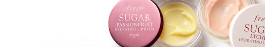 A close up banner of two Fresh Sugar Hydrating Lip Balms on a white background