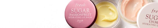 A close up banner of two Fresh Sugar Hydrating Lip Balms on a white background