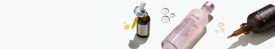 Three bottles of Fresh serums open on a white background