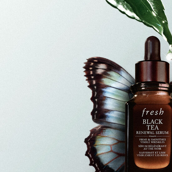 Black tea serum bottle with butterfly and leaf