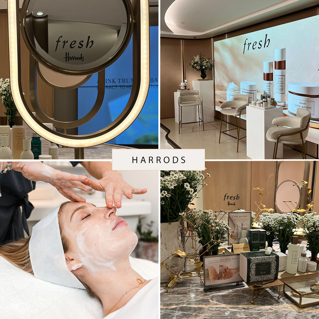 Inside of a Harrods store, with a woman re-arranging a display.