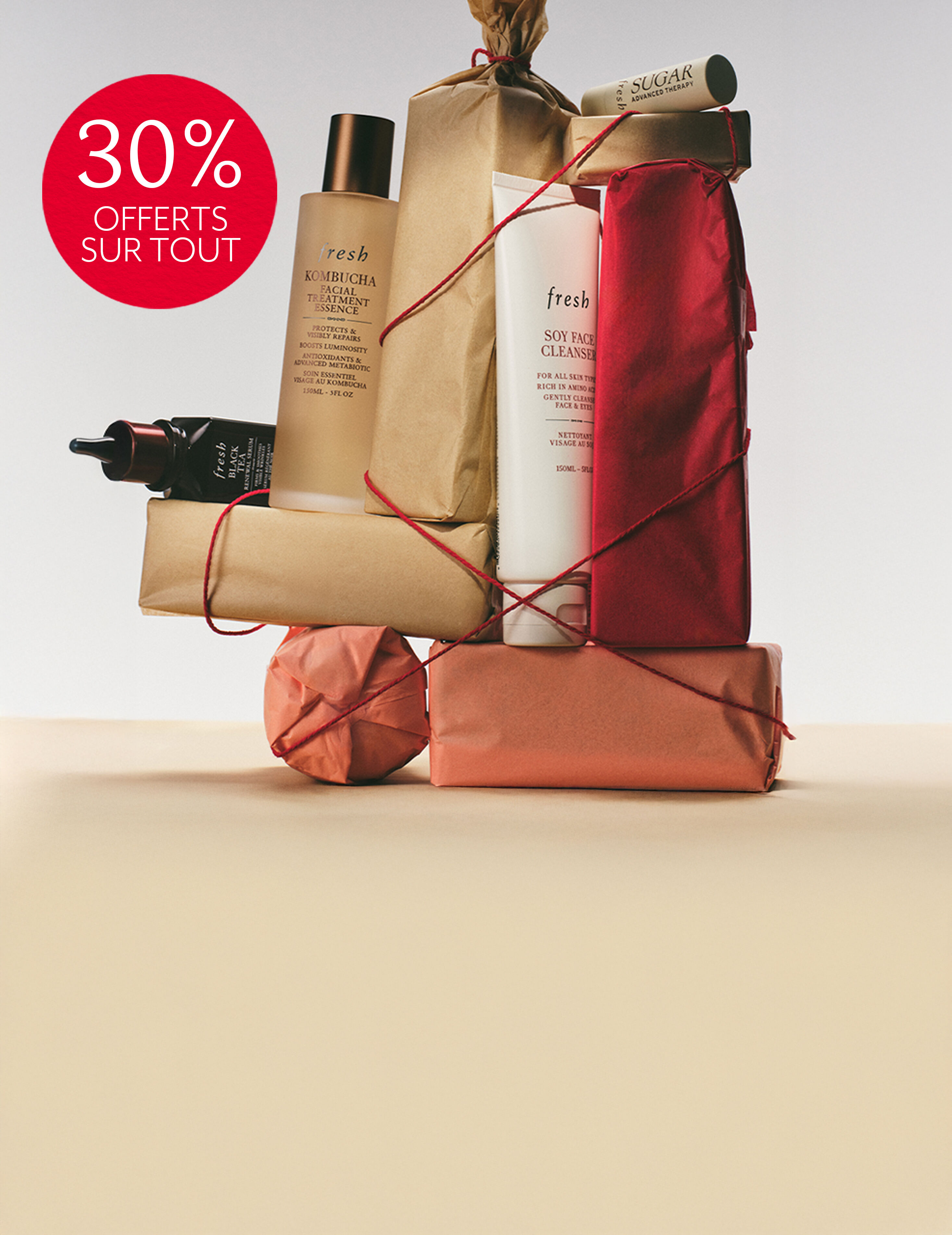 soy face cleanser bottle with bubbles on dark background